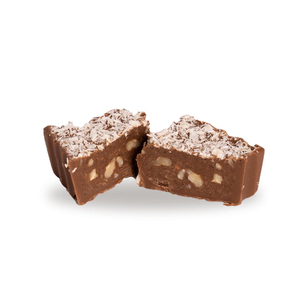 A milk chocolate Moghli broken open, showing the coconut and nuts inside