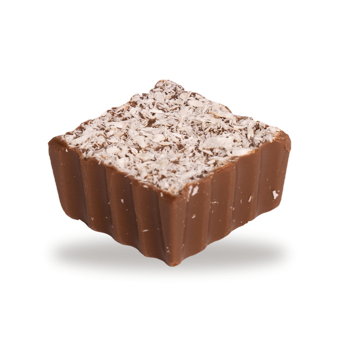 A whole Moghli — a milk chocolate square with coconut and nuts