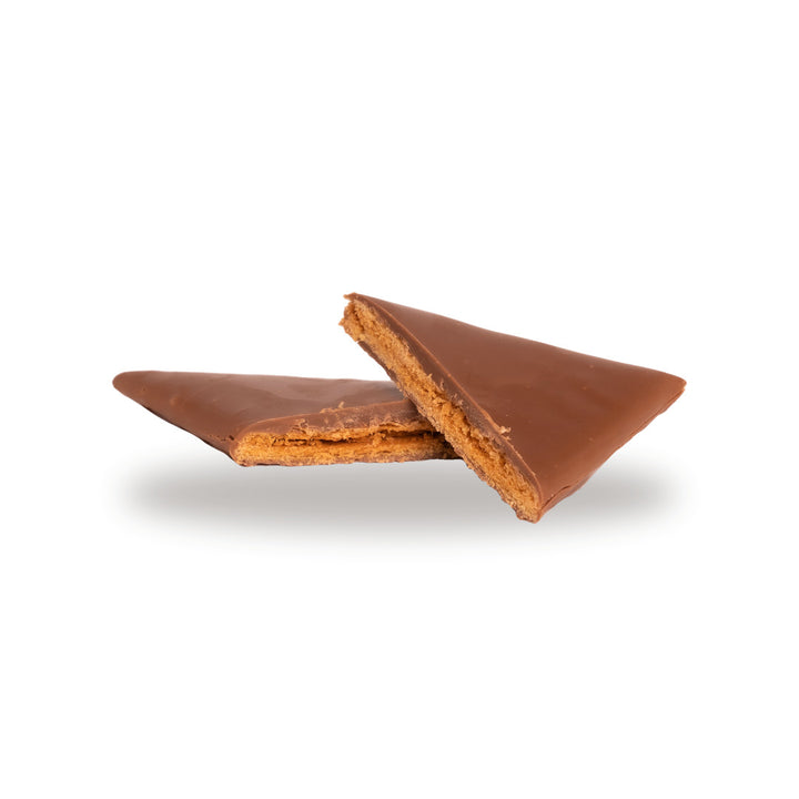 A milk chocolate Jumbo Crêpe Triangle broken open, showing the caramelized sugar inside