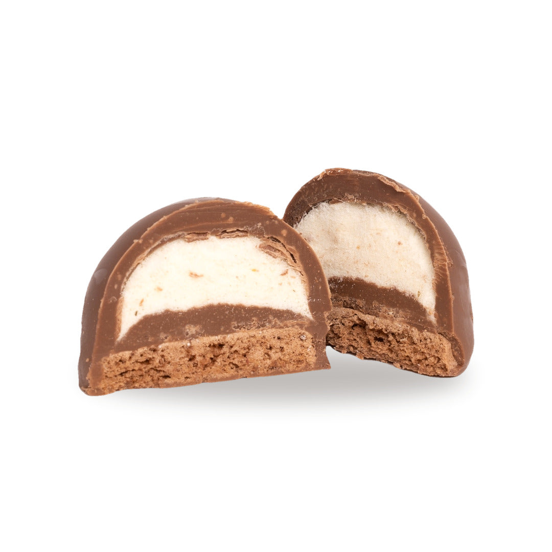 A milk chocolate Cotton Candy Biscuit broken open, showing the filling inside