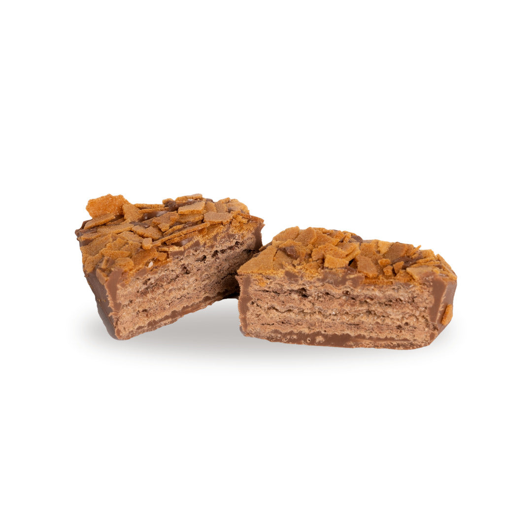 A milk chocolate Crêpe Wafer broken open, showing the filling inside