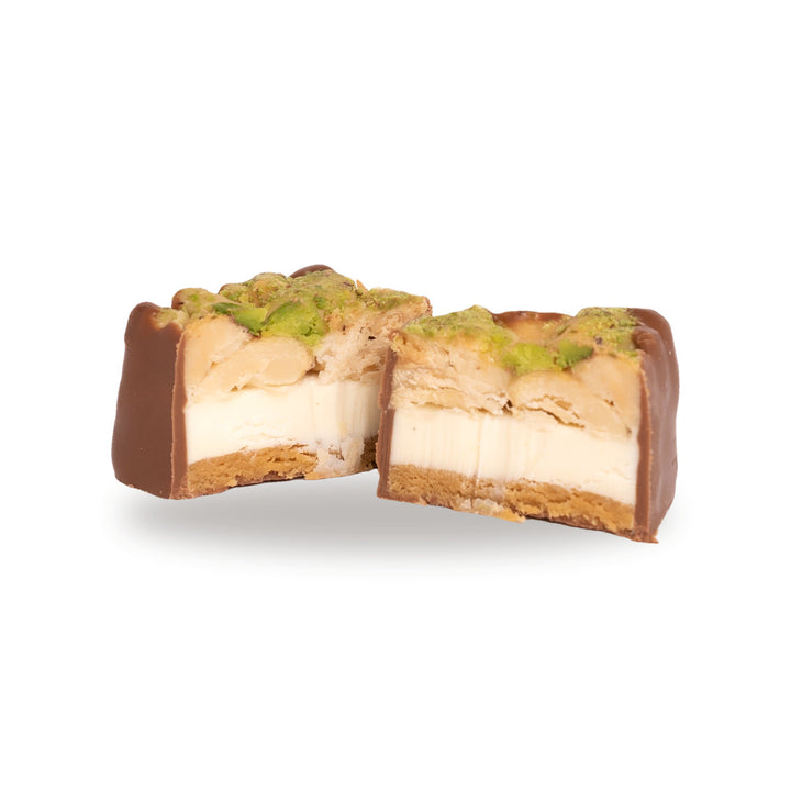 A milk chocolate Madlouka broken open, showing the nuts inside