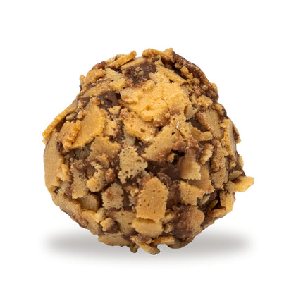 A whole Hazelnut Caramel Feuilletine — a milk chocolate piece