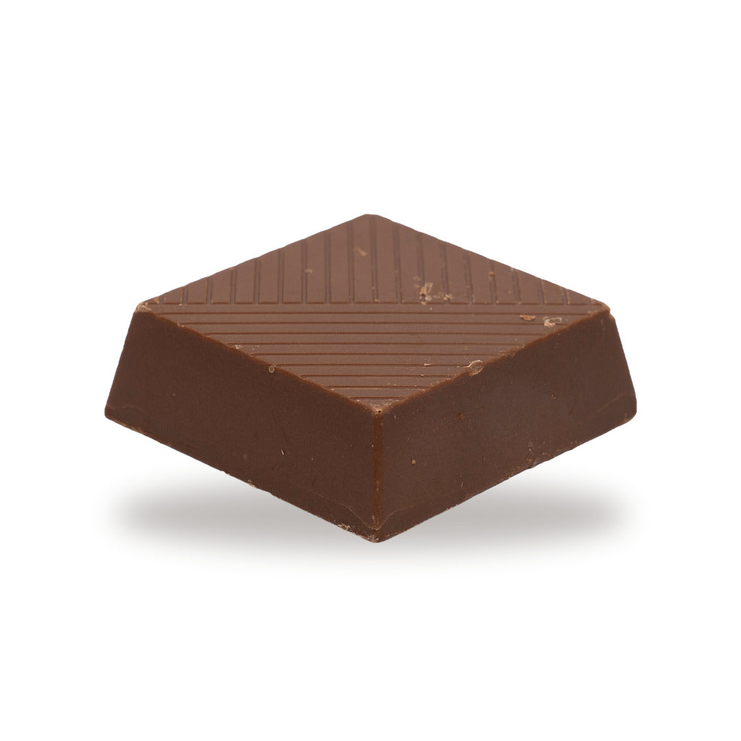 A whole Pistachio Paste — a milk chocolate piece