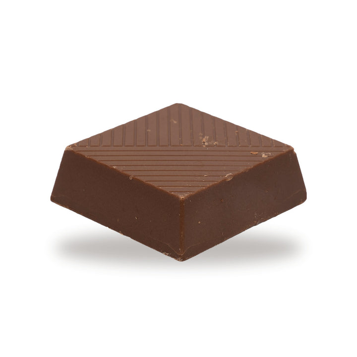 A whole Pistachio Paste — a milk chocolate piece