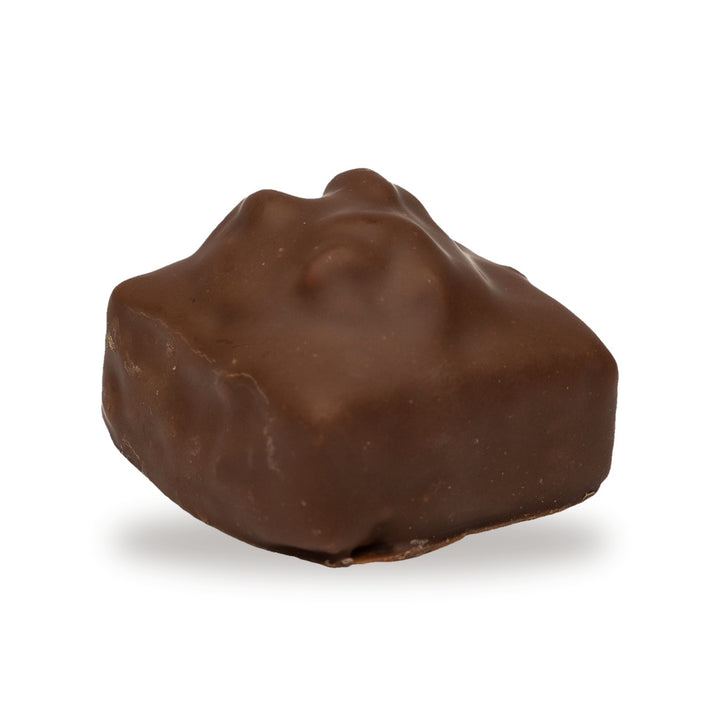 A whole Fig Sesame Walnut — a milk chocolate piece