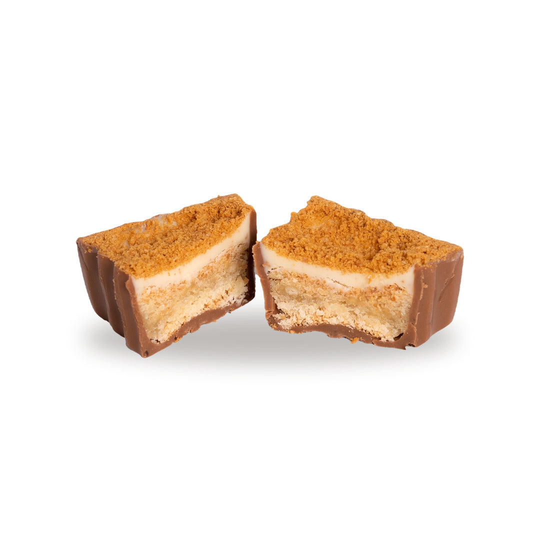 A milk chocolate Kenefe broken open, showing the sweet cream inside