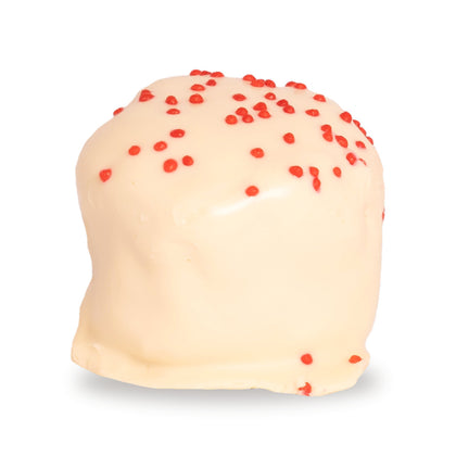 A whole Red Velvet Cupcake — a white chocolate round with brownie