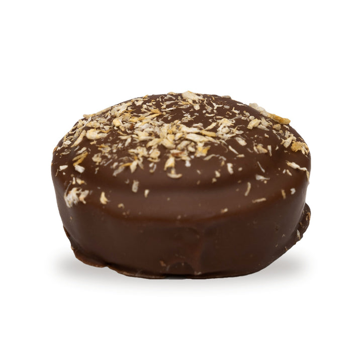 A whole Double Coconut Cookie — a milk chocolate round