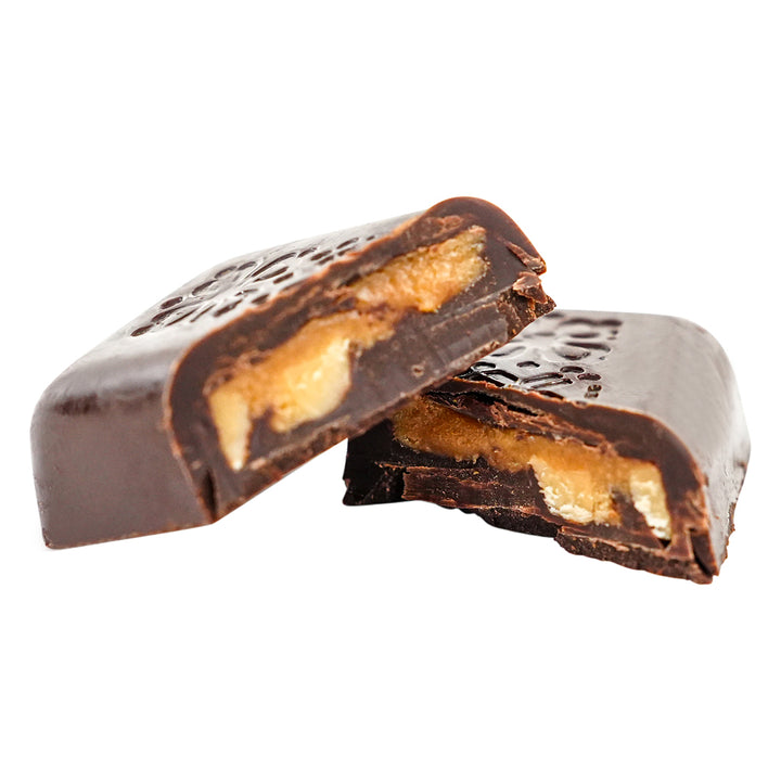 Caramel With Almonds Dark rectangular chocolate with floral engraved design.