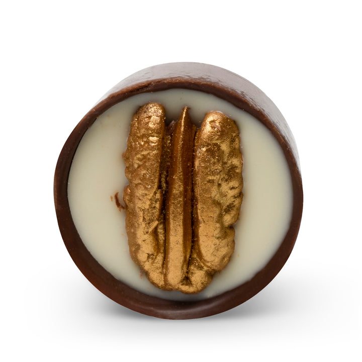 Round milk chocolate cup filled with white mastic cream and whole pecan, Tiara Mastic Pecan by Chocolate Counter