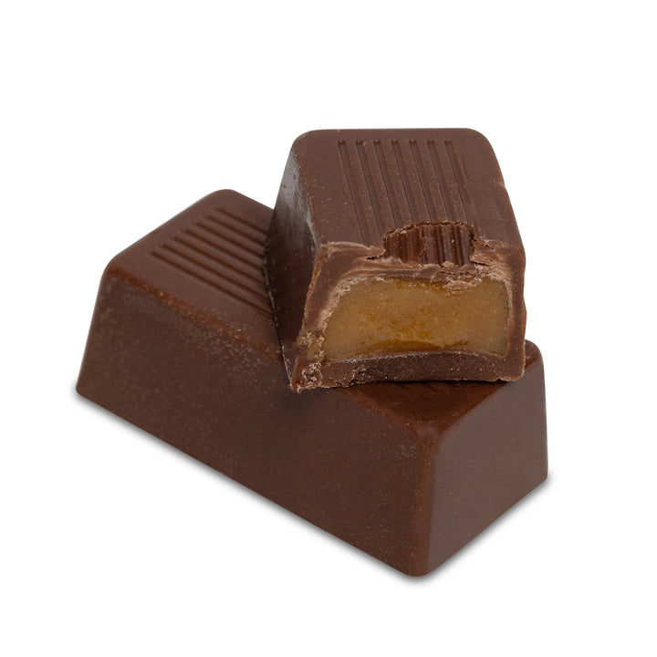 Milk chocolate bar with caramel filling exposed