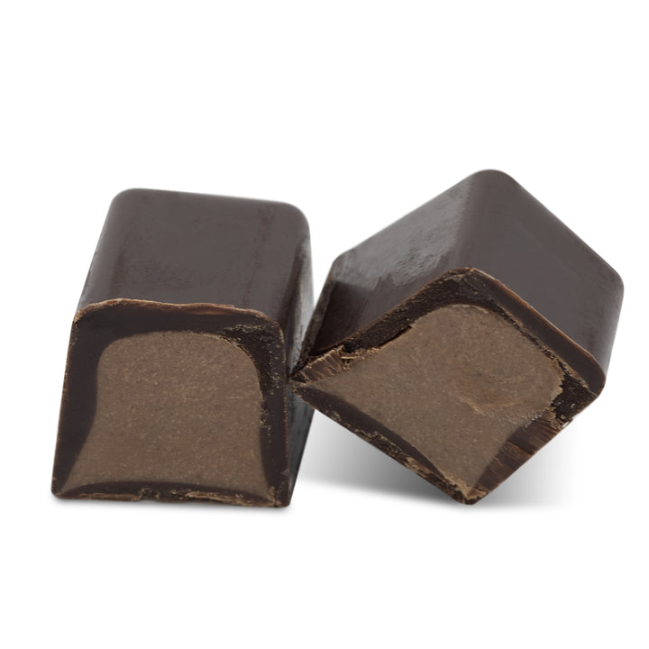 Interior view showing orange cream filling inside dark chocolate shell