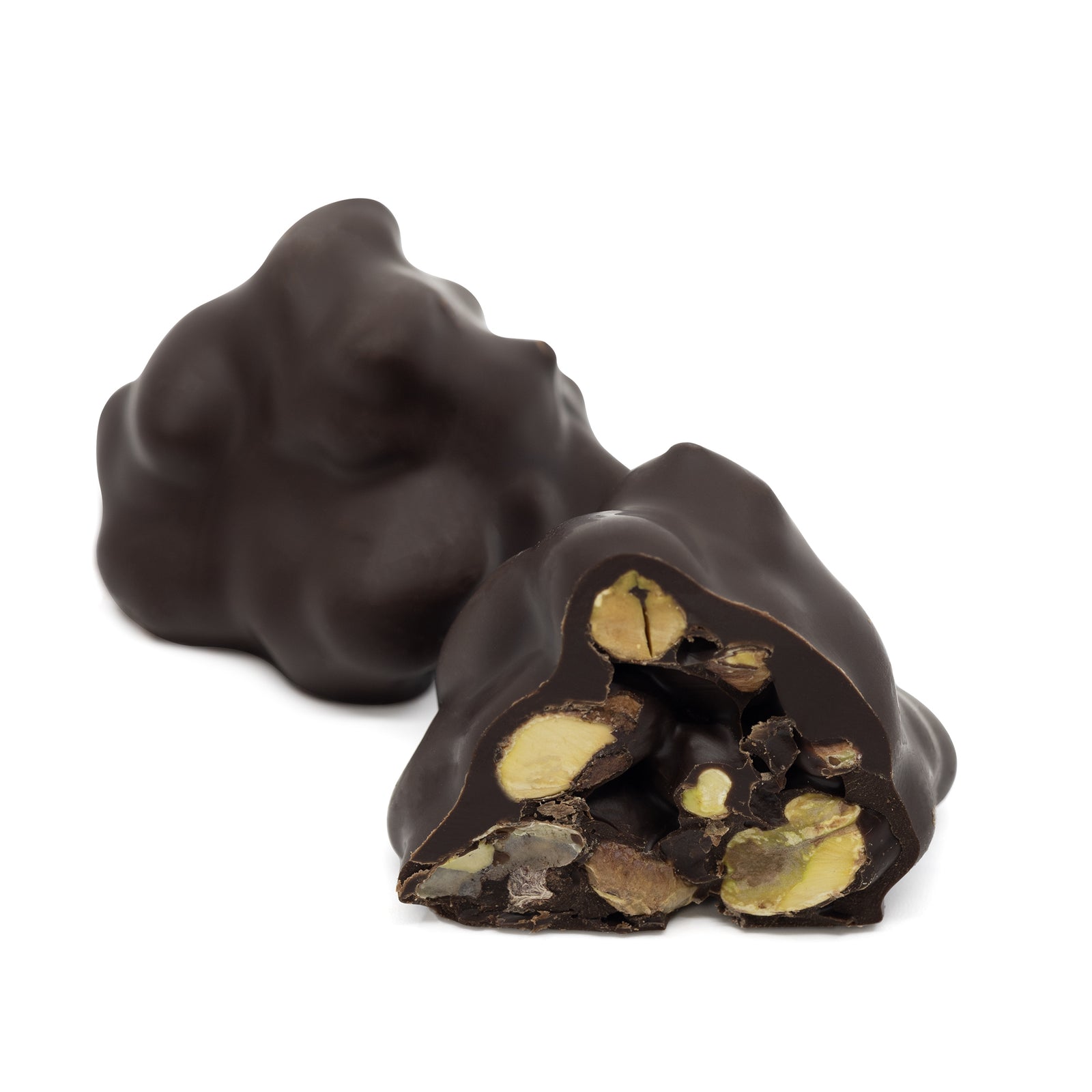 Roche Pistachio Dark cut open to reveal whole pistachios inside, by Chocolate Counter