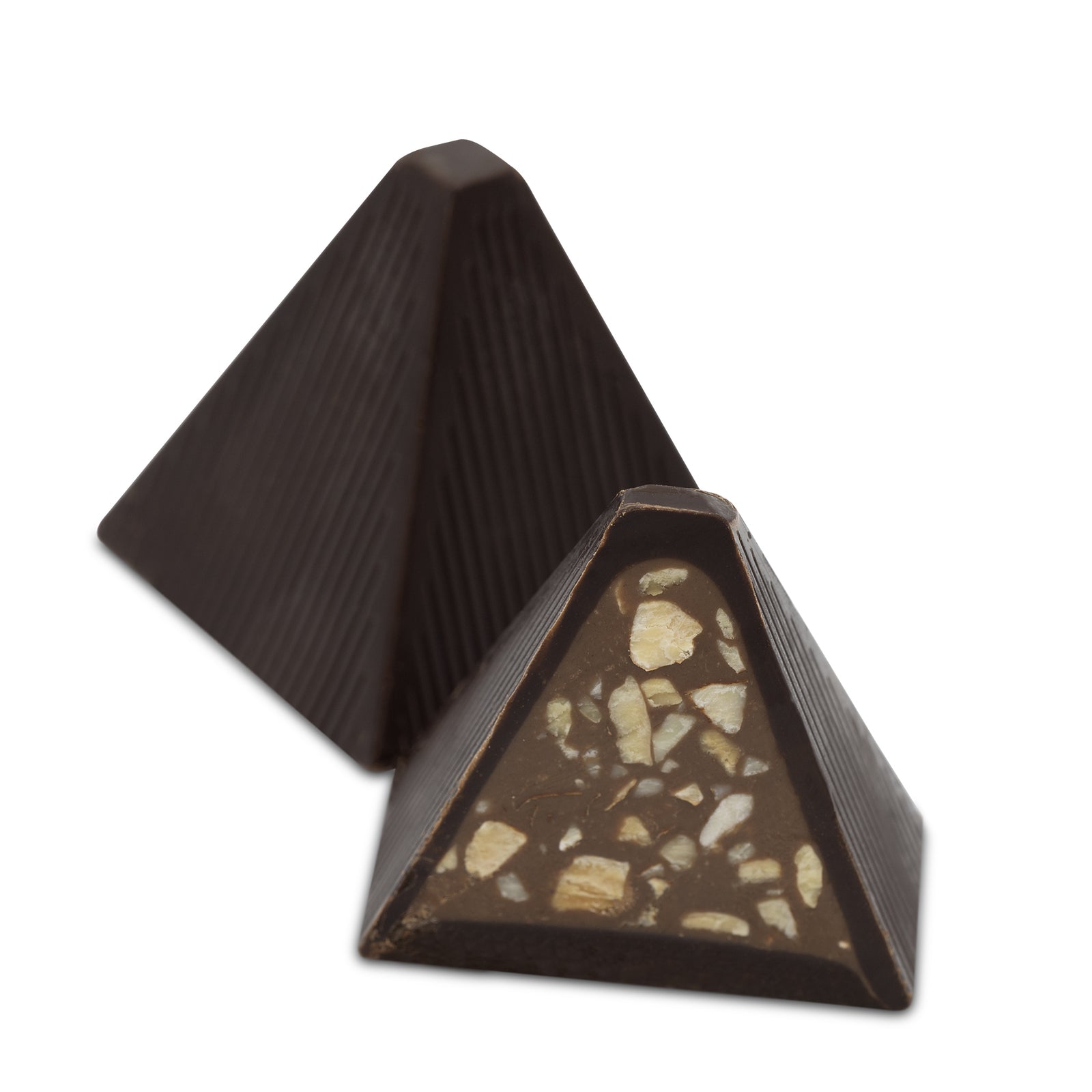 Interior view showing chopped nut filling inside dark chocolate pyramid