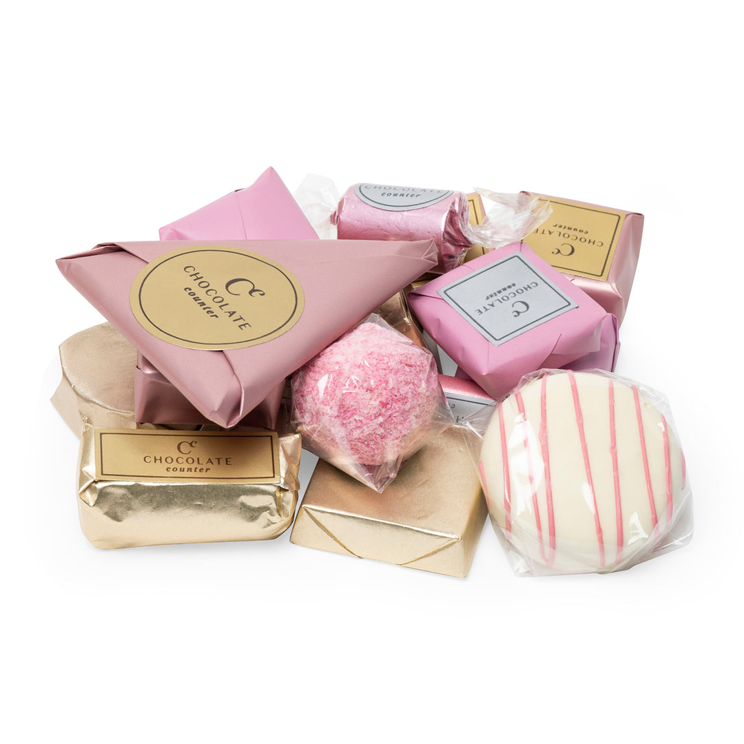 Pink and gold baby motif chocolates assortment