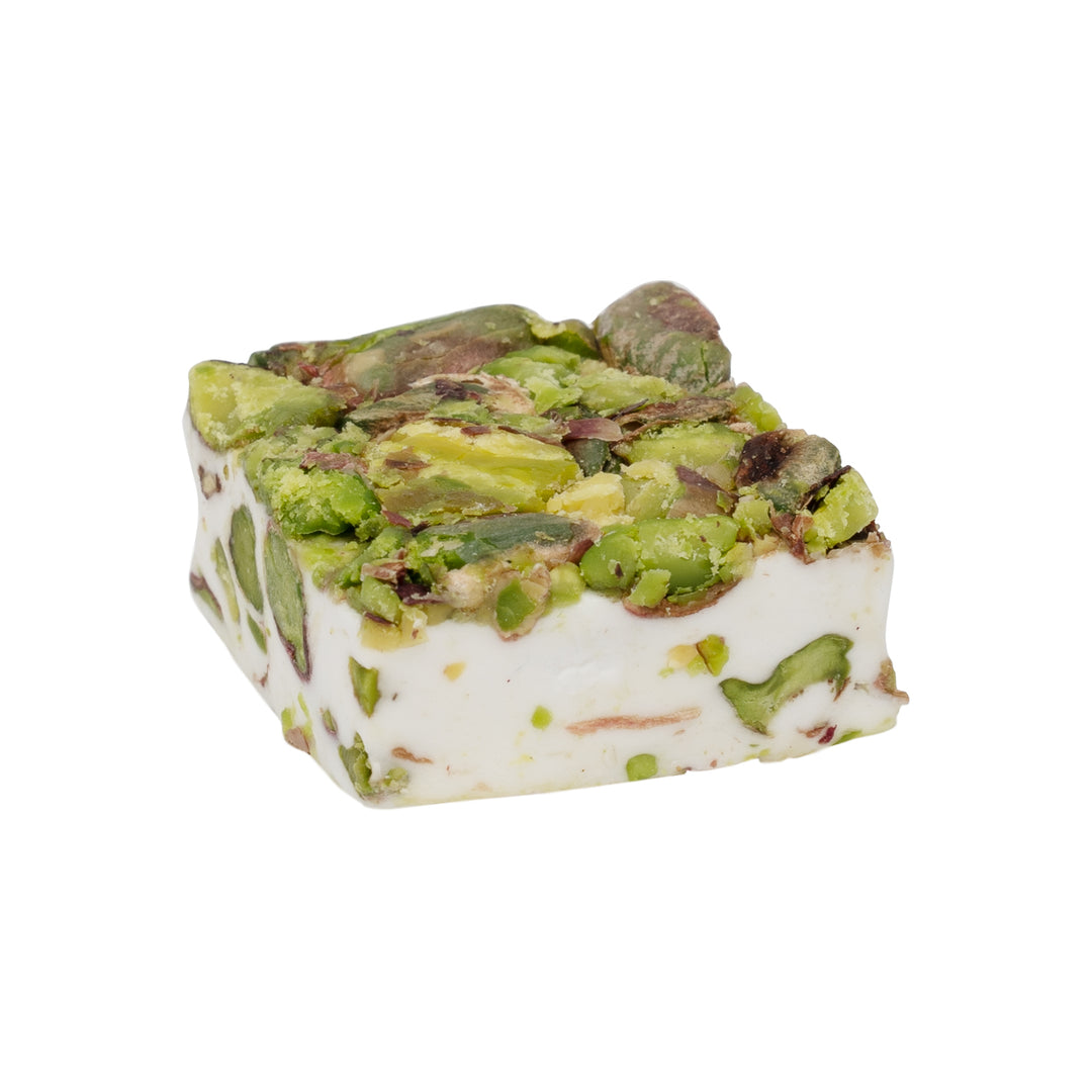 Square nougat topped with crunchy pistachios