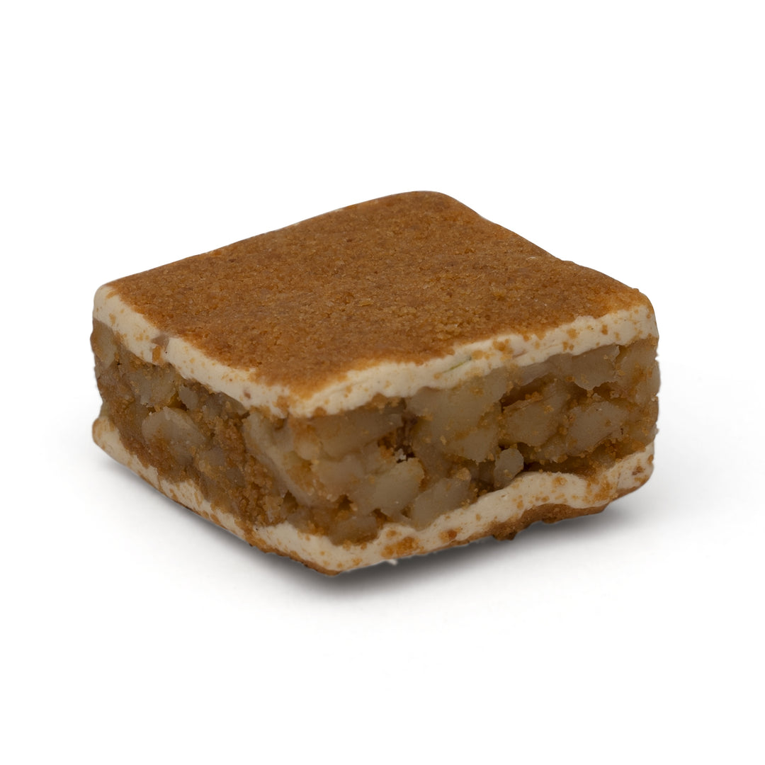 Square nougat candy with walnut filling