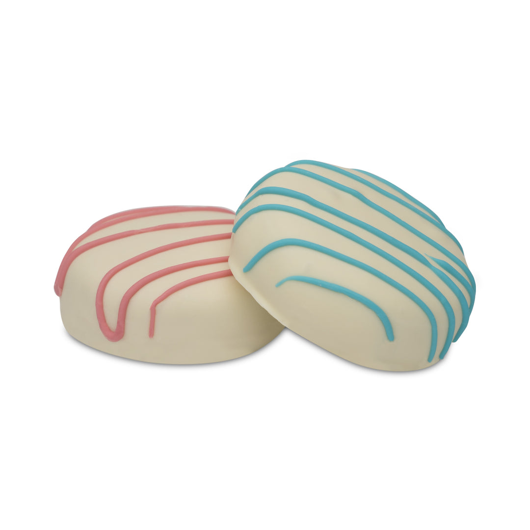 Cocoa cookie treats coated in white chocolate with pink and blue drizzle