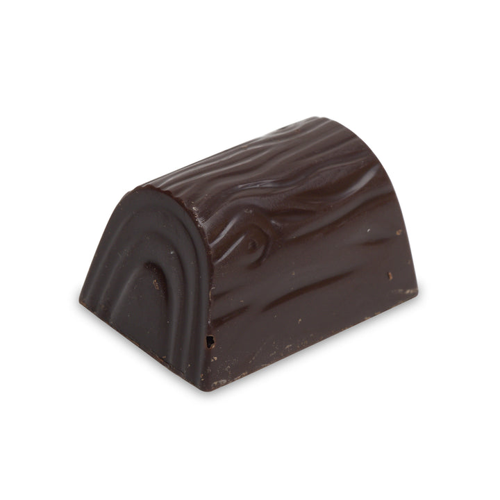 Dome-shaped dark chocolate shell filled with halawa and pistachios