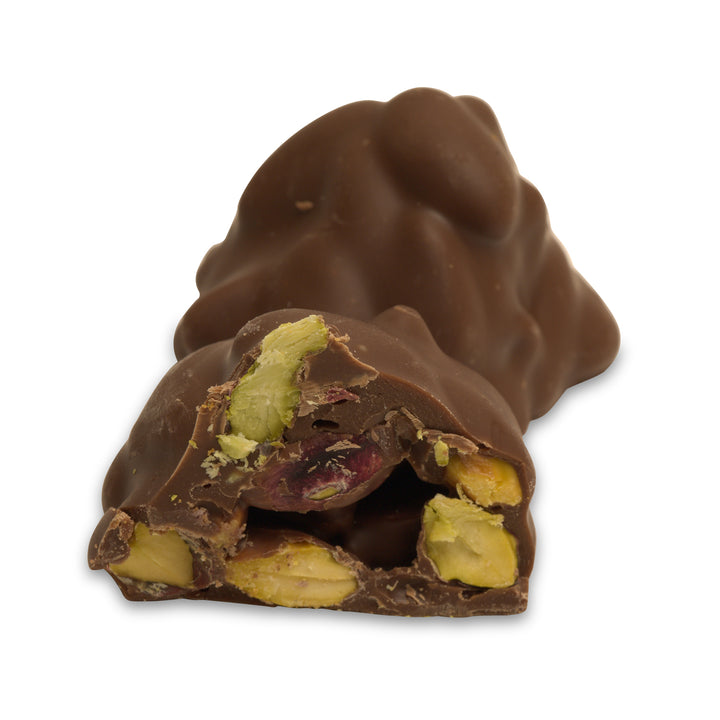 Interior view showing pistachio pieces inside milk chocolate shell